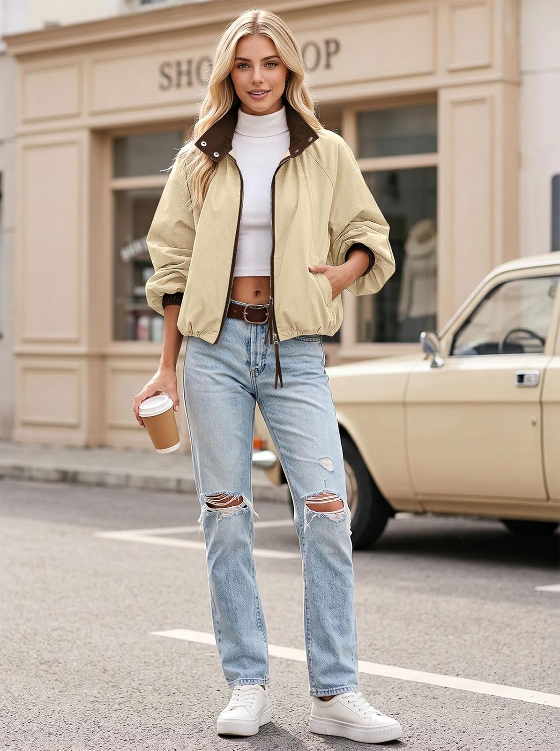 Cropped bomber jacket styled as a fall layering piece.